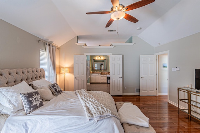 bedroom featuring dark wood-type flooring, lofted ceiling, visible vents, and baseboards