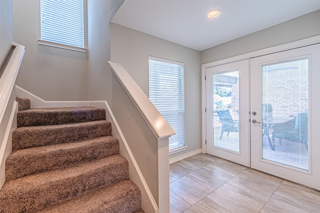 entryway featuring french doors, stairway, recessed lighting, and baseboards