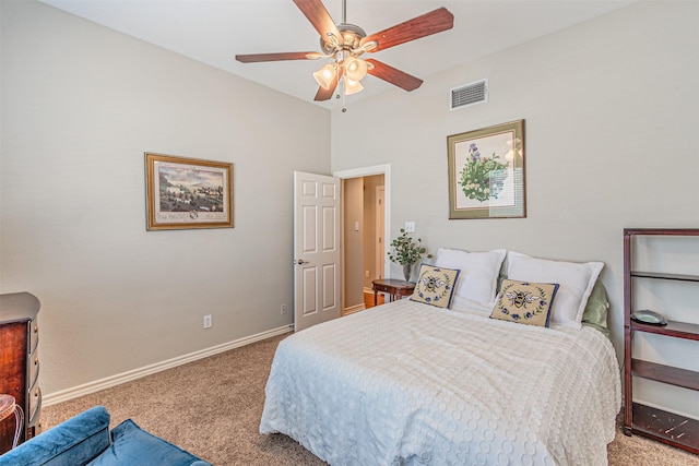 carpeted bedroom featuring a ceiling fan, visible vents, and baseboards