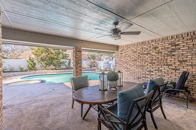 view of patio / terrace with a ceiling fan, a fenced in pool, and a fenced backyard