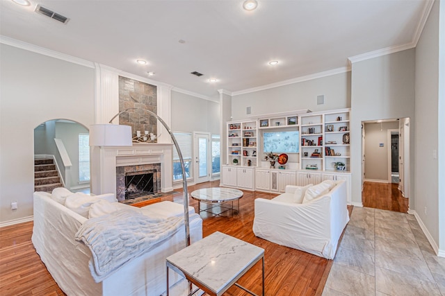 living area with plenty of natural light and crown molding