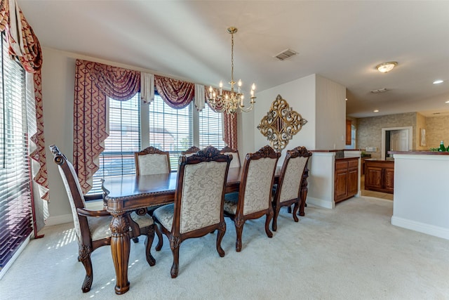 dining room with a chandelier, recessed lighting, light colored carpet, visible vents, and baseboards