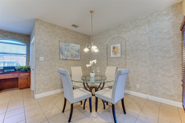 dining room featuring baseboards, visible vents, an inviting chandelier, and light tile patterned flooring