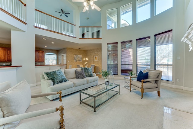 living area featuring light carpet, recessed lighting, a ceiling fan, and baseboards