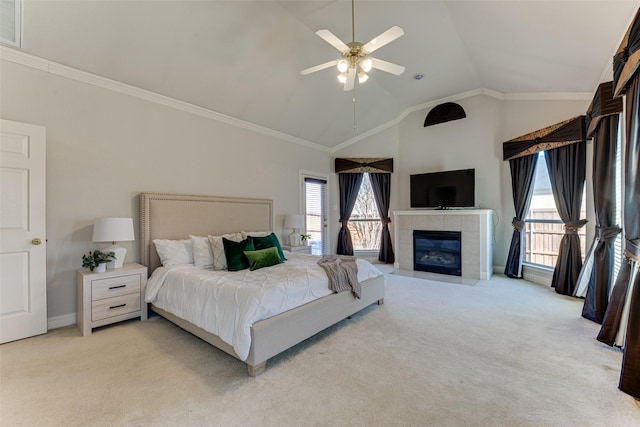 bedroom with ornamental molding, access to outside, light colored carpet, and a tile fireplace