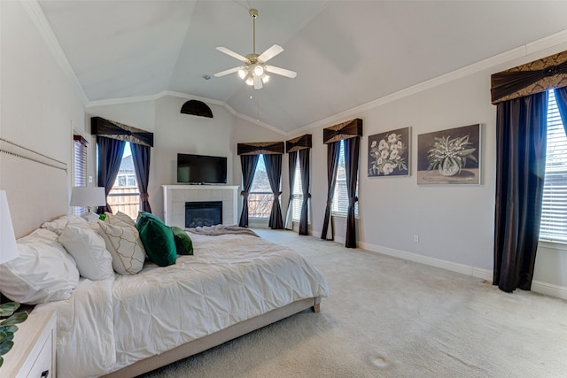 bedroom featuring lofted ceiling, light colored carpet, a tiled fireplace, ornamental molding, and baseboards