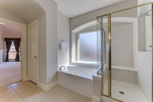 bathroom featuring a whirlpool tub, a stall shower, baseboards, and tile patterned floors