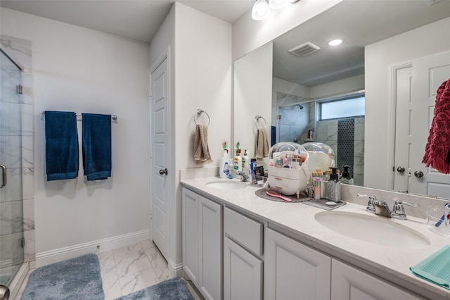 bathroom with marble finish floor, a sink, visible vents, and a shower stall