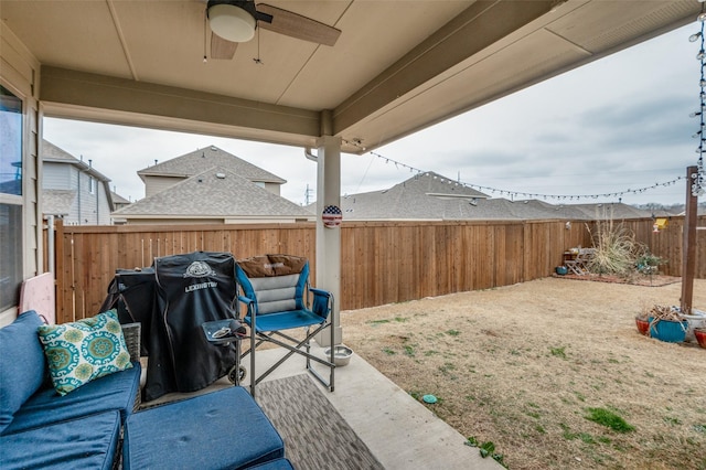 view of patio / terrace featuring a fenced backyard, a ceiling fan, and a grill