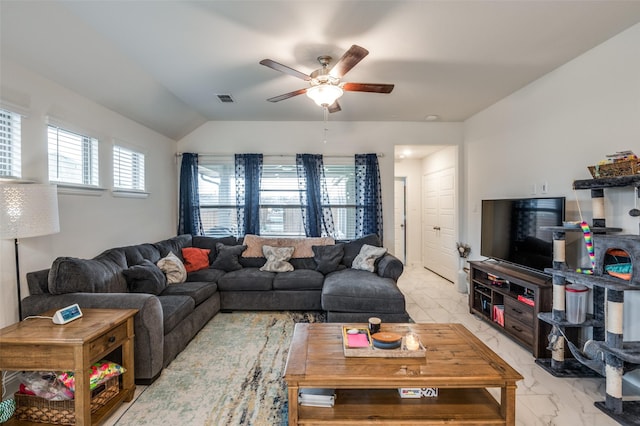 living area with lofted ceiling, marble finish floor, visible vents, and a ceiling fan