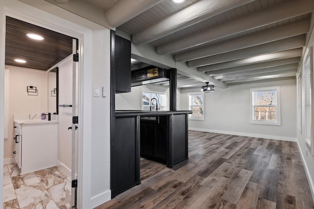 below grade area with wooden ceiling, baseboards, and wood finished floors