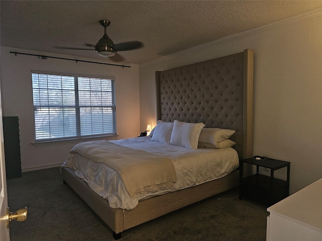 bedroom featuring ornamental molding, dark colored carpet, ceiling fan, and a textured ceiling