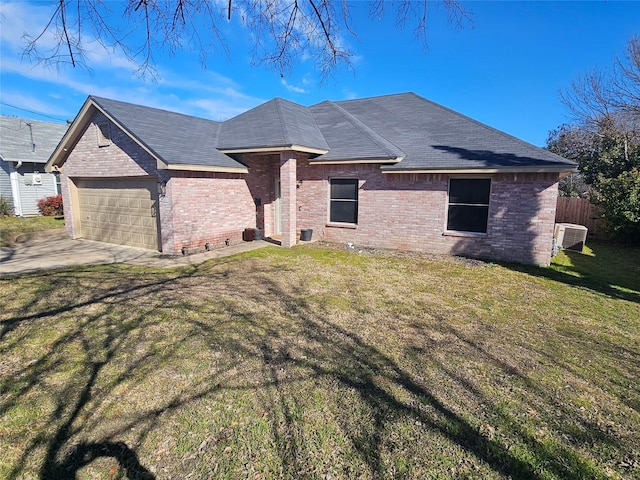 ranch-style house featuring a garage, brick siding, fence, driveway, and a front lawn