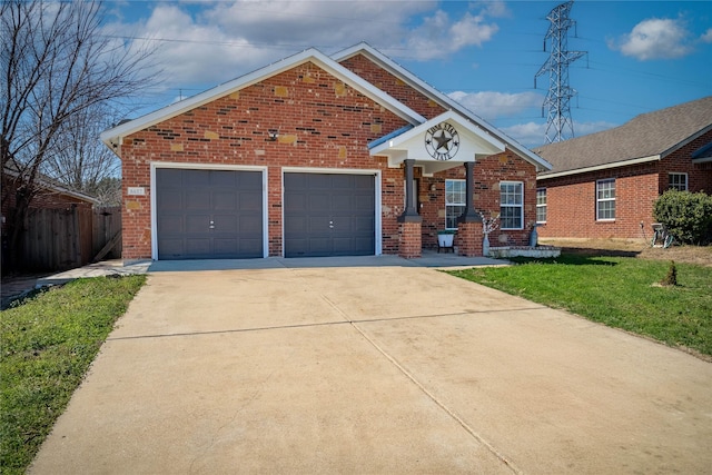 view of front of property featuring driveway, brick siding, an attached garage, and a front yard