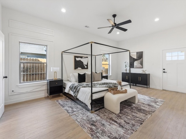 bedroom featuring light wood-type flooring, baseboards, visible vents, and recessed lighting