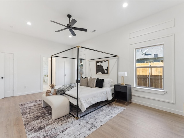 bedroom featuring recessed lighting, visible vents, light wood-style flooring, and baseboards