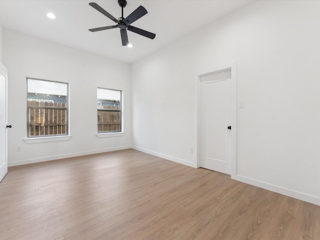 unfurnished room with a ceiling fan, light wood-type flooring, baseboards, and recessed lighting