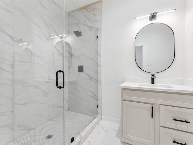 full bathroom featuring marble finish floor, baseboards, vanity, and a marble finish shower