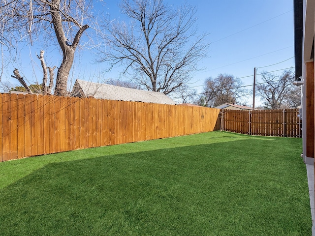 view of yard featuring a fenced backyard