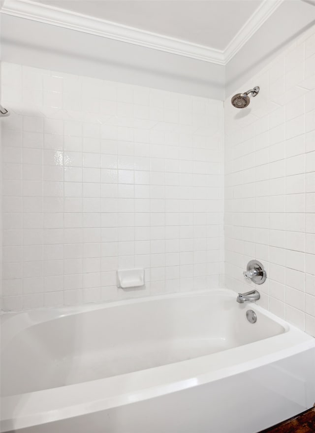 full bathroom with ornamental molding and washtub / shower combination