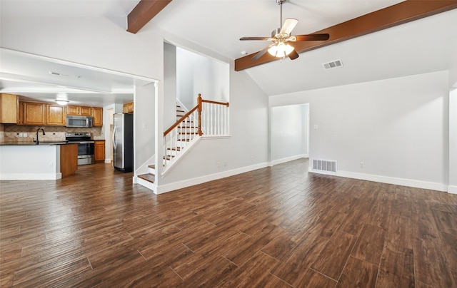 unfurnished living room featuring dark wood-style floors, visible vents, beamed ceiling, baseboards, and stairs