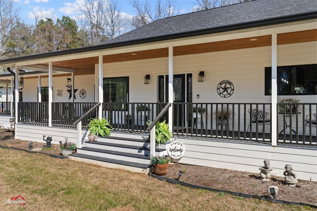 exterior space with a shingled roof and covered porch