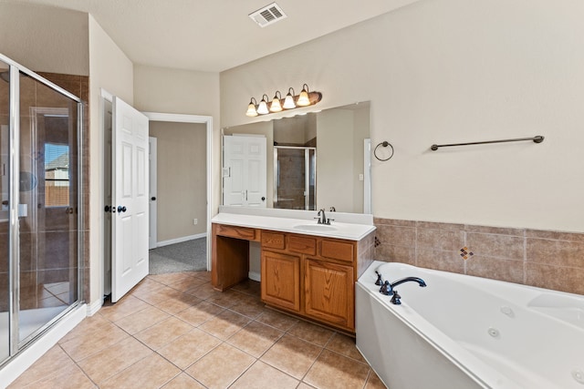 bathroom featuring visible vents, tile patterned floors, a jetted tub, vanity, and a shower stall