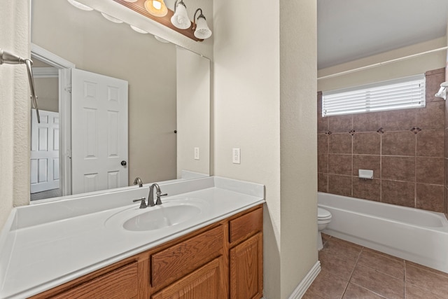 bathroom with toilet,  shower combination, tile patterned flooring, and vanity