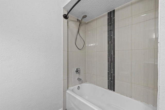 full bathroom featuring a textured ceiling, a textured wall, and washtub / shower combination