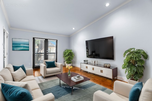 living area featuring baseboards, ornamental molding, wood finished floors, french doors, and recessed lighting