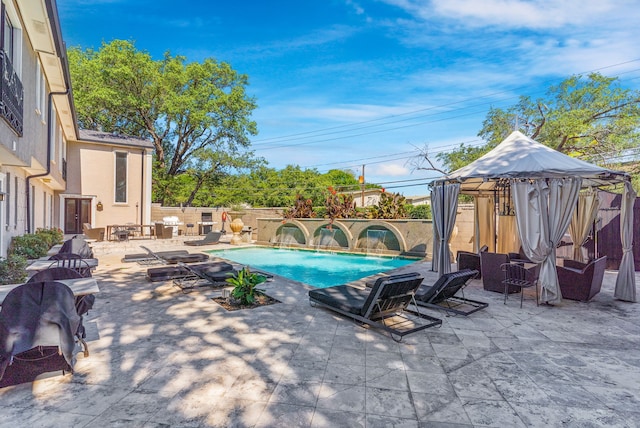 view of swimming pool with a gazebo, a patio, a fenced backyard, and a fenced in pool