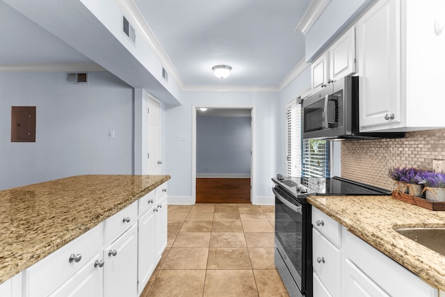 kitchen with light stone countertops, white cabinets, appliances with stainless steel finishes, decorative backsplash, and crown molding