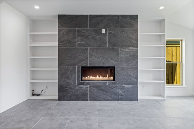 details with built in features, recessed lighting, and a fireplace