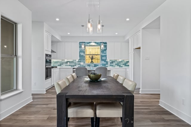 dining room featuring recessed lighting, wood finished floors, visible vents, and baseboards