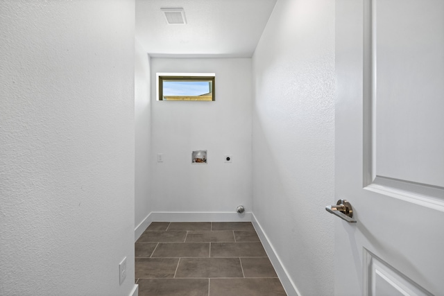 laundry room featuring washer hookup, visible vents, electric dryer hookup, laundry area, and baseboards