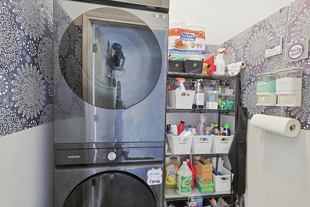 laundry area featuring laundry area and stacked washing maching and dryer