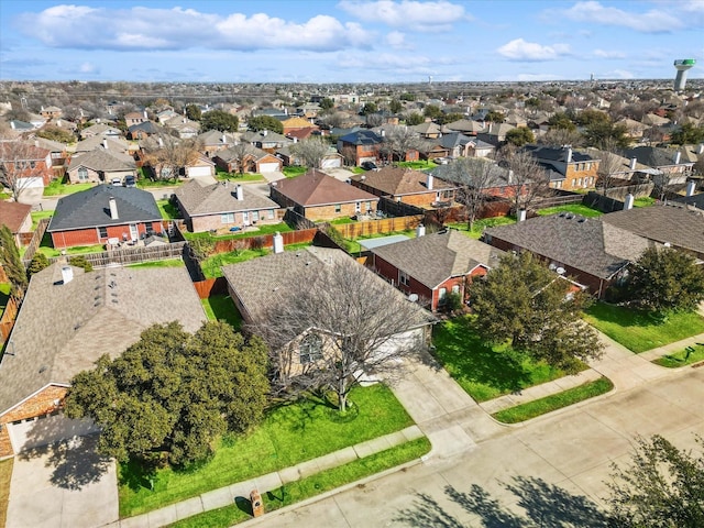 birds eye view of property with a residential view