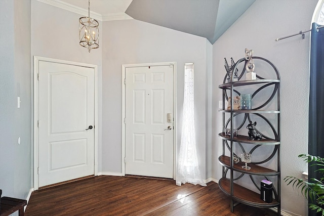 entrance foyer featuring baseboards, dark wood-style flooring, vaulted ceiling, a chandelier, and a wealth of natural light