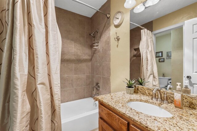 full bath featuring shower / bathtub combination with curtain and vanity