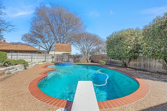 view of swimming pool featuring a diving board, a fenced in pool, and a fenced backyard