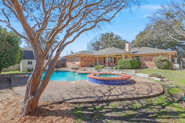 view of pool featuring a fenced in pool, ceiling fan, fence, an in ground hot tub, and a patio