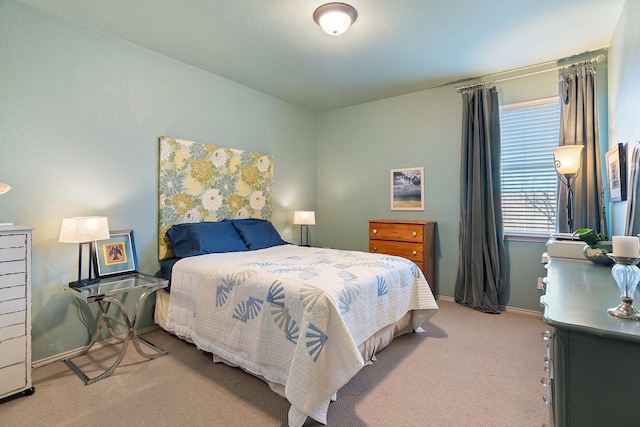 carpeted bedroom with baseboards