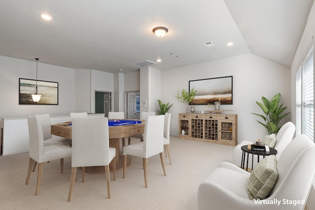 dining room featuring light carpet, visible vents, vaulted ceiling, and recessed lighting