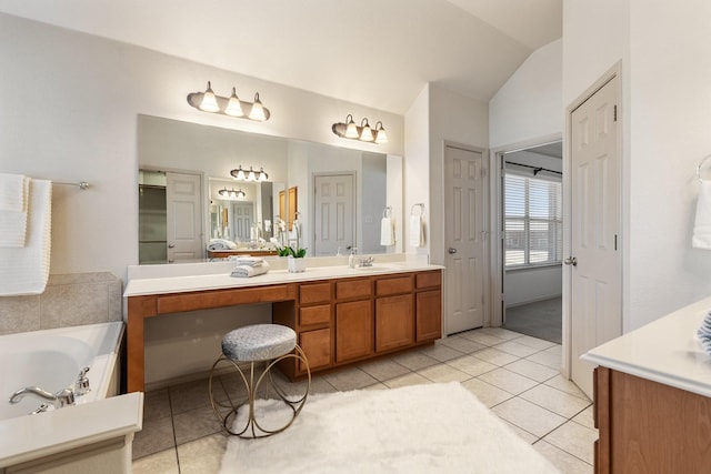 full bathroom featuring lofted ceiling, tile patterned flooring, vanity, a closet, and a bath