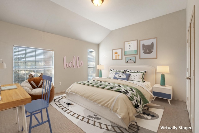 bedroom featuring carpet, vaulted ceiling, and baseboards