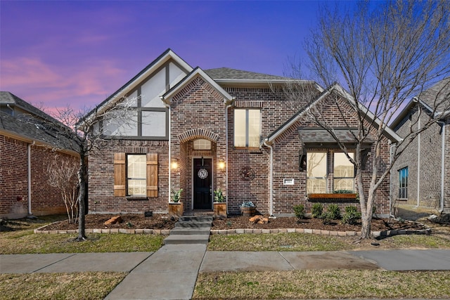 view of front of property with brick siding