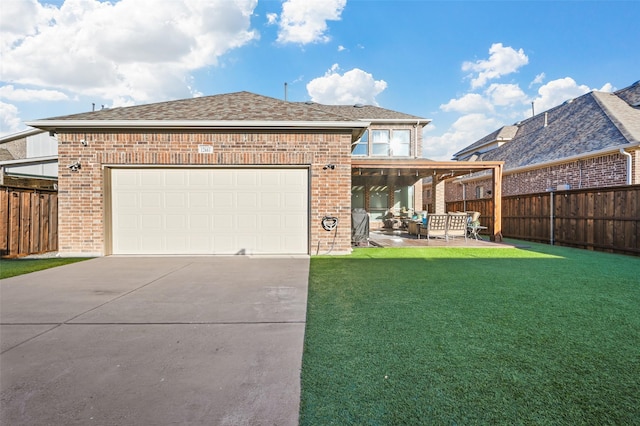 view of front of property featuring driveway, fence, a front lawn, and brick siding