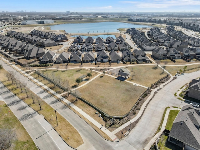 birds eye view of property with a residential view and a water view