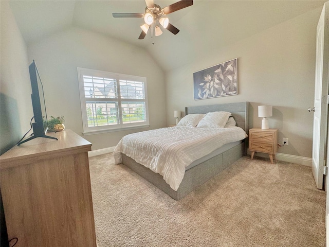 bedroom with light carpet, ceiling fan, vaulted ceiling, and baseboards