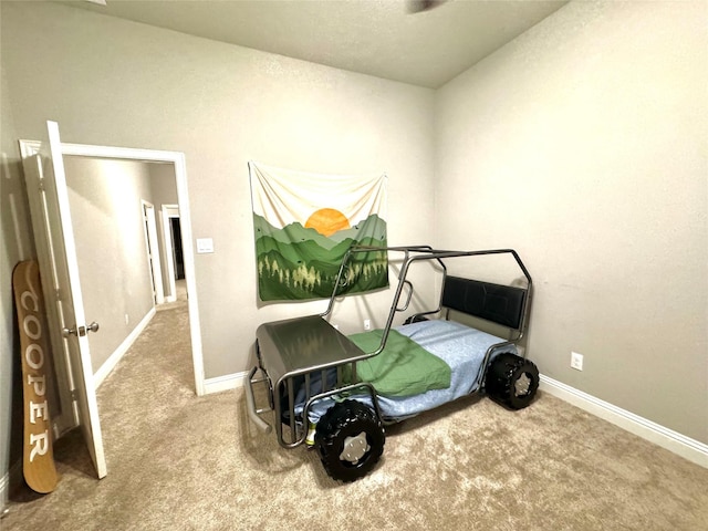 bedroom featuring carpet floors and baseboards